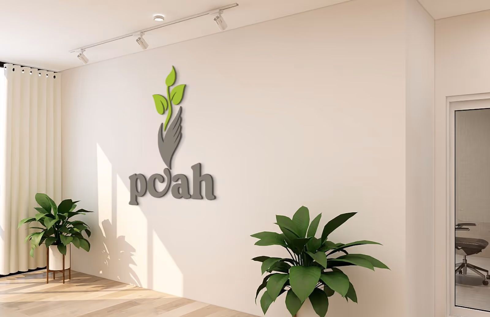 Modern reception area with logo on wall, white walls, and potted plants.