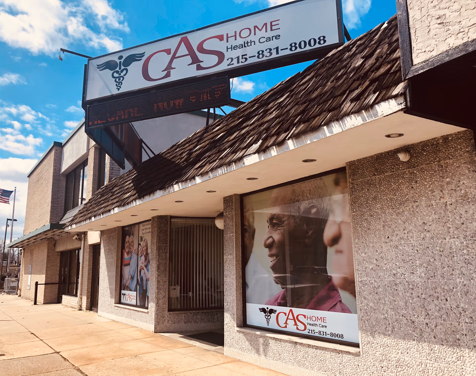 Exterior view of CAS Home Health Care storefront with signage and large windows.