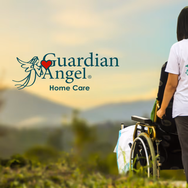 Outdoor scene with Guardian Angel Home Care logo and a wheelchair beside a person.