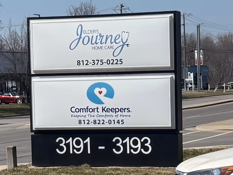 A double-panel outdoor sign for Elder's Journey Home Care of Columbus and Comfort Keepers.