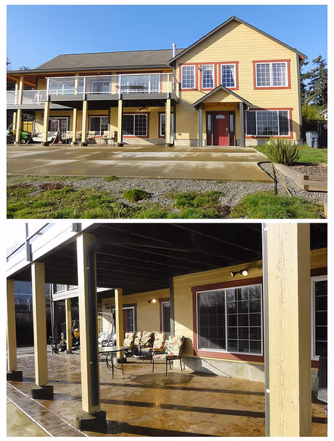 Two-story yellow senior living facility with red front door and covered outdoor seating.